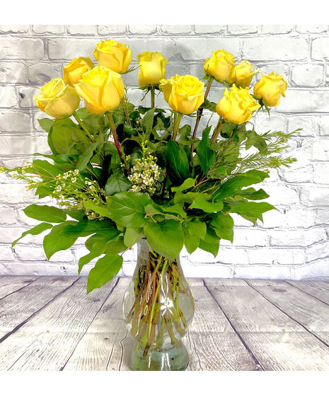 One dozen of the finest Ecuadorian roses carefully hand-arranged in a glass vase. A natural beauty!