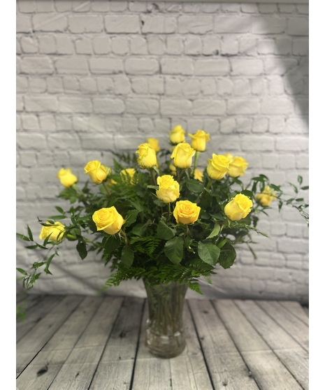 One dozen of the finest Ecuadorian roses carefully hand-arranged in a glass vase. A natural beauty!