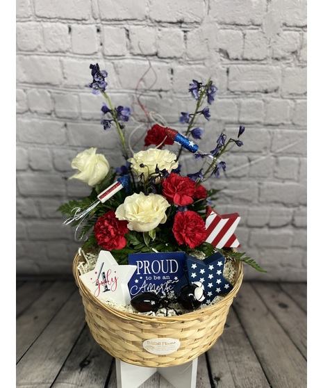patriotic flowers with America-themed accents in basket