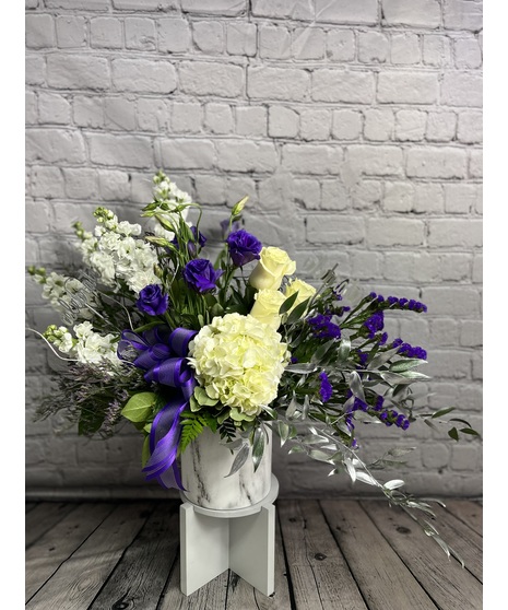 white, cream, and purple floral arrangement in TCU colors